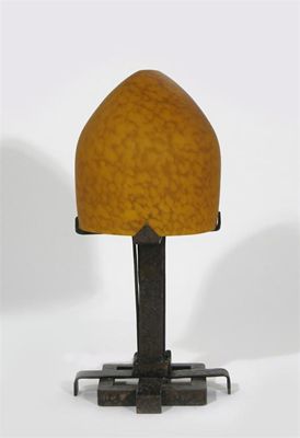 Appraisal: A wrought iron and glass desk lamp in the manner