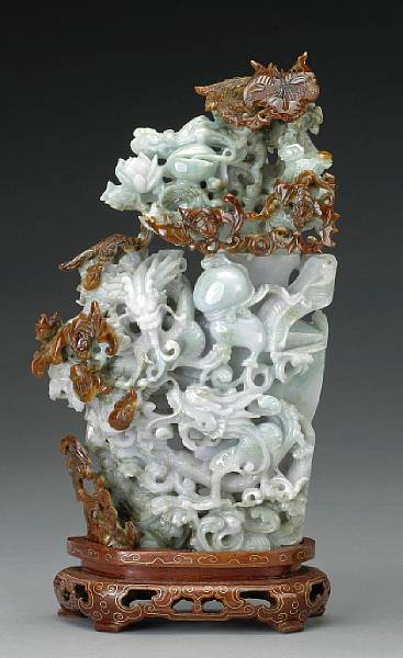 Appraisal: A pale greenish white jadeite covered vase with russet markings