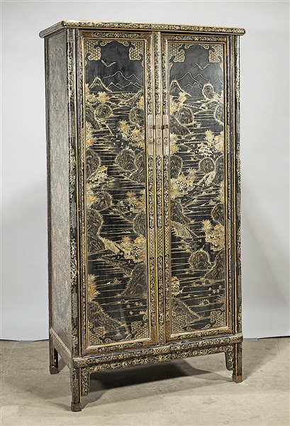 Appraisal: Chinese wood two door cabinet with ink color and gilt