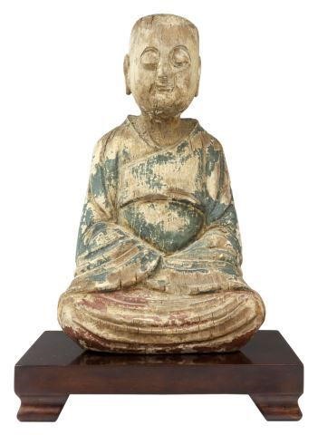 Appraisal: Chinese carved wood Buddha seated in meditation with remnants of