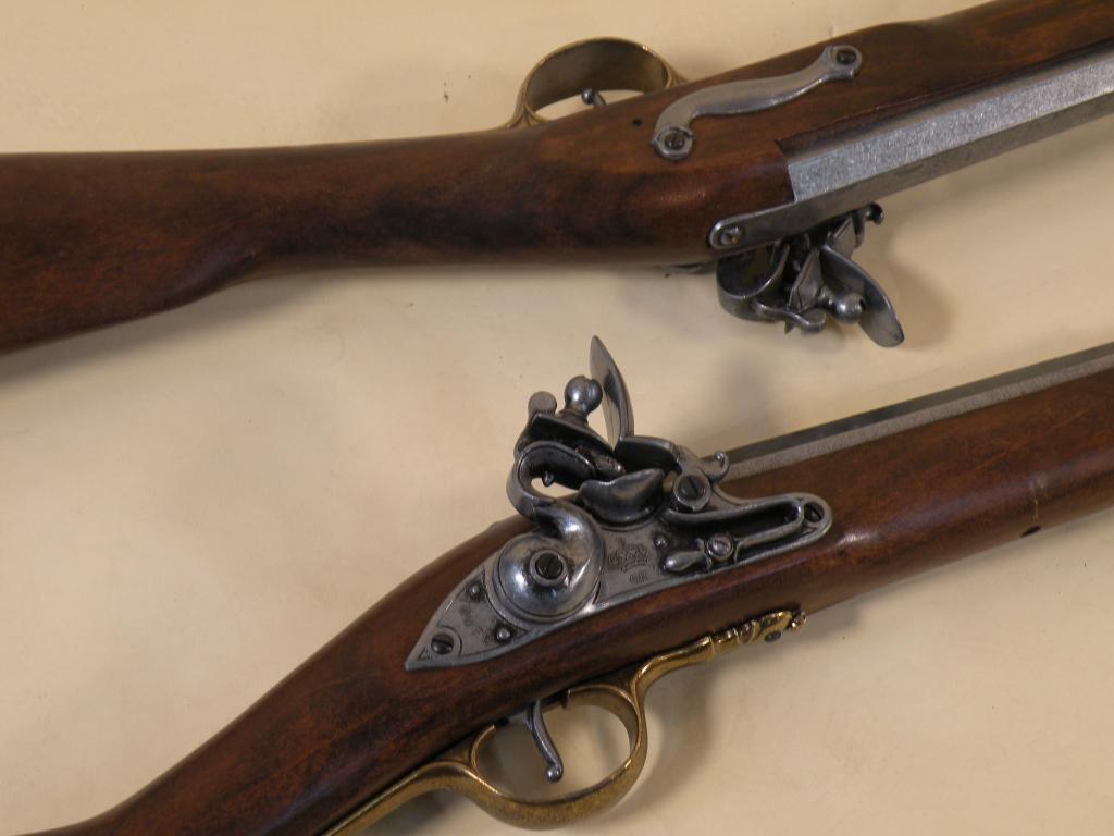 Appraisal: A pair of stained beech replica muskets and bayonets in