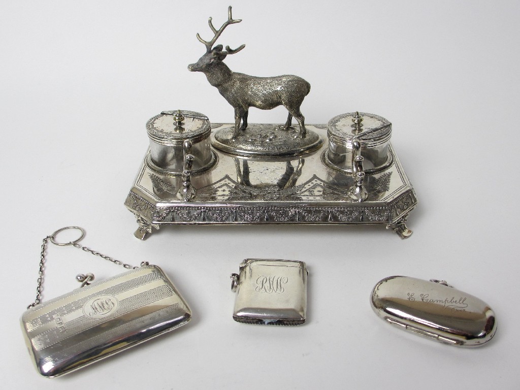 Appraisal: A silver plated inkstand with stag surmount a silver purse