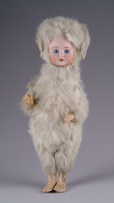 Appraisal: GERMAN BISQUE DOLL IN RABBIT OUTFIT This socket head German