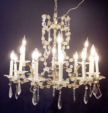 Appraisal: CRYSTAL CHANDELIER Chains of faceted crystal and pendalogue crystal prisms