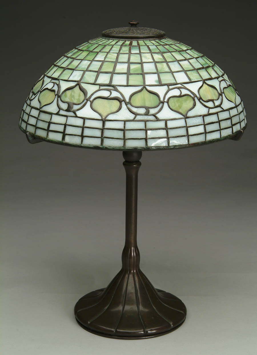 Appraisal: TIFFANY ACORN TABLE LAMP Orange-green striated acorns on striated green