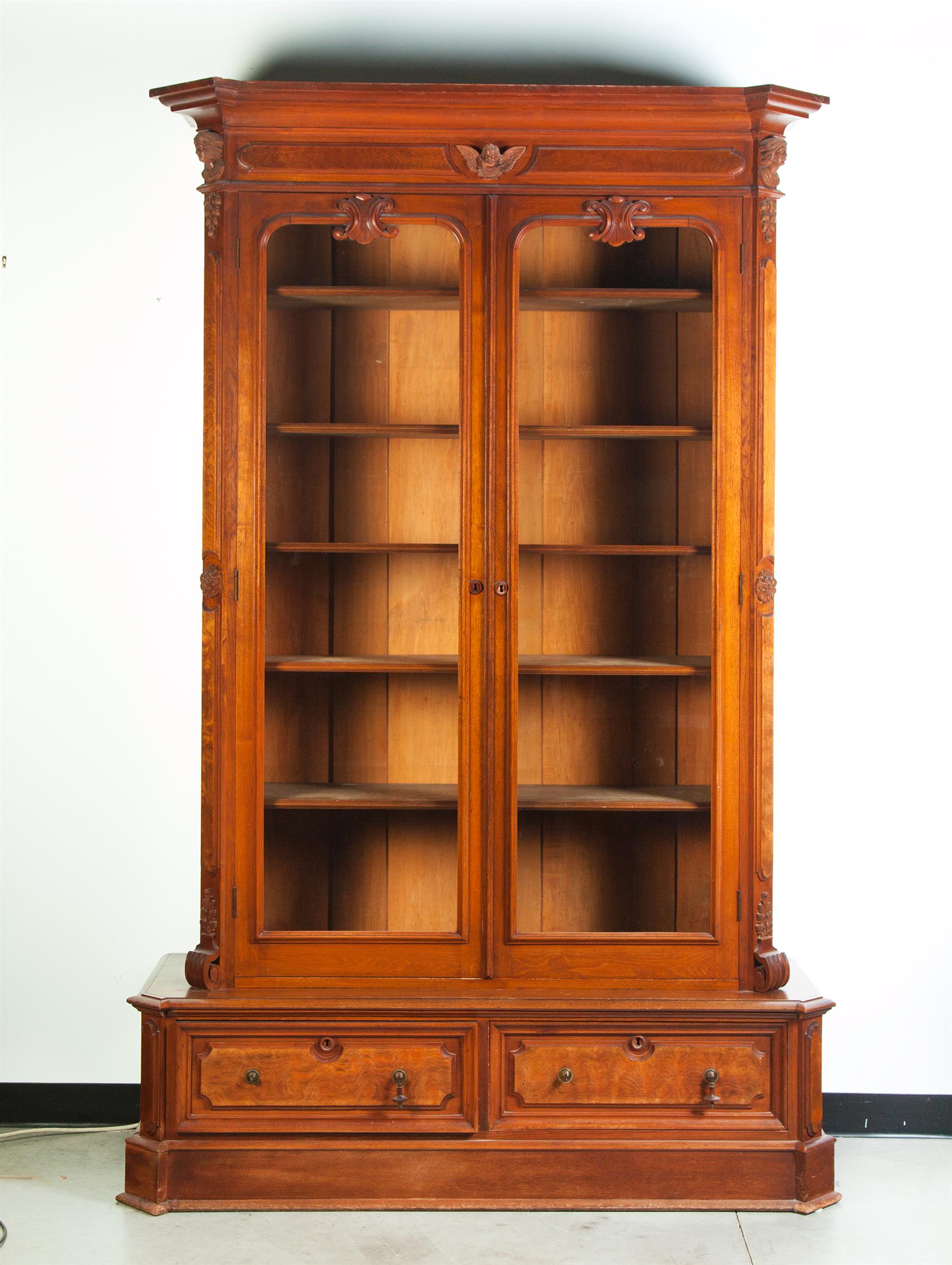 Appraisal: TWO-PIECE VICTORIAN BOOKCASE American rd quarter- th century walnut Molded