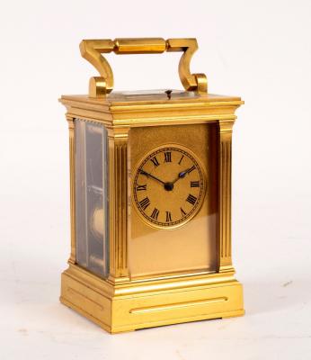 Appraisal: A gilt brass hour-repeat carriage clock with fluted columns to