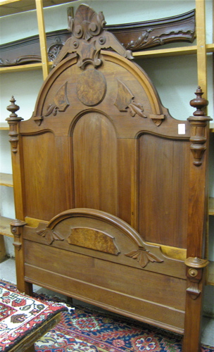 Appraisal: VICTORIAN WALNUT BED American th century the tall panel headboard