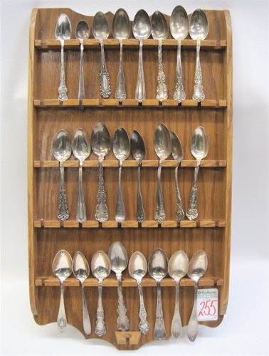 Appraisal: TWENTY-FOUR COLLECTORS SPOONS WALL SHELF pieces Includes sterling silver spoons