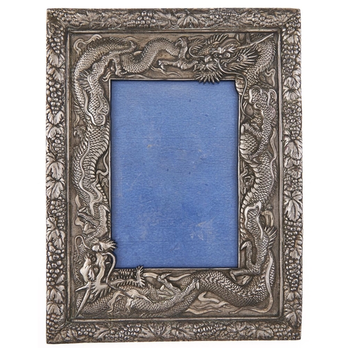 Appraisal: A Chinese silver repousse photograph frame c with dragon surround