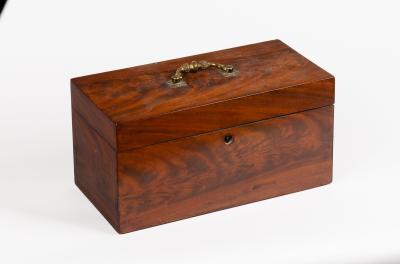 Appraisal: A George III mahogany tea caddy with brass handle to