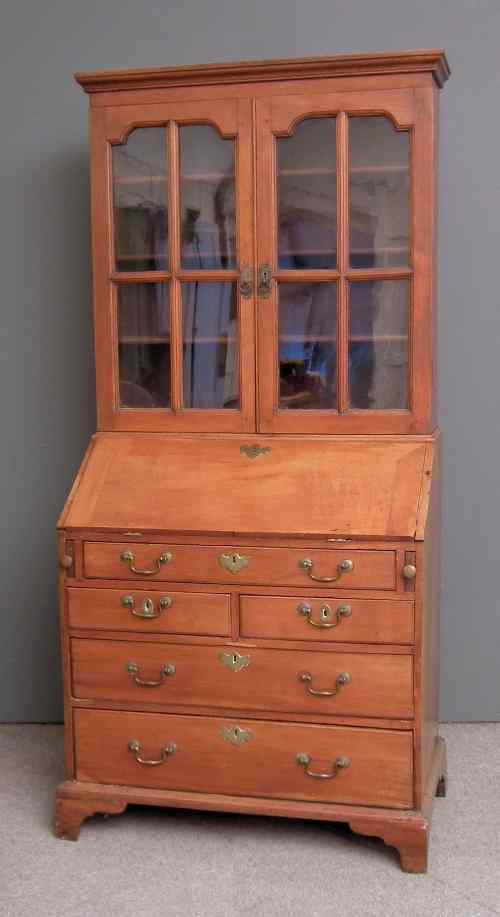 Appraisal: A George III mahogany bureau bookcase the upper part with