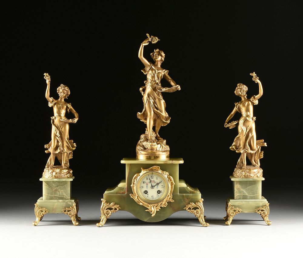 Appraisal: AN ART NOUVEAU GILT METAL AND ONYX THREE PIECE CLOCK