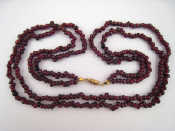 Appraisal: A two row garnet bead necklace beads approx mm cm