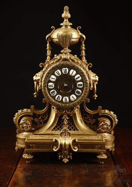 Appraisal: A Louis XVI style lacquered bronze mantel clock A Louis