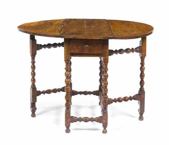 Appraisal: A William and Mary Style Walnut Gate-Leg Table having a