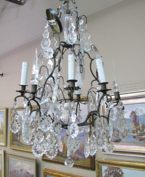 Appraisal: A traditional style chandelier with crystal prisms -light candlestick style