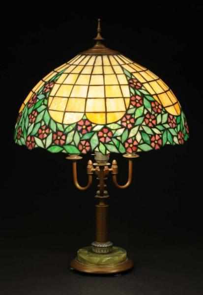 Appraisal: Victorian Leaded Glass Lamp Description diameter shade on brass and