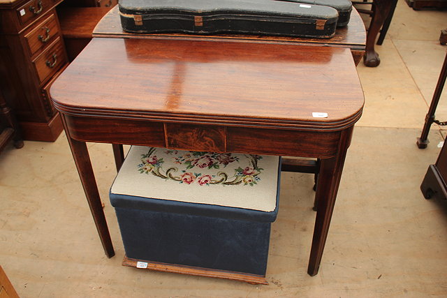 Appraisal: A GEORGIAN MAHOGANY FOLD OVER TEA TABLE with rounded front