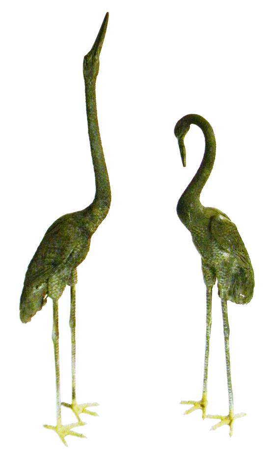 Appraisal: th C cast-metal garden statuary two standing cranes largest with