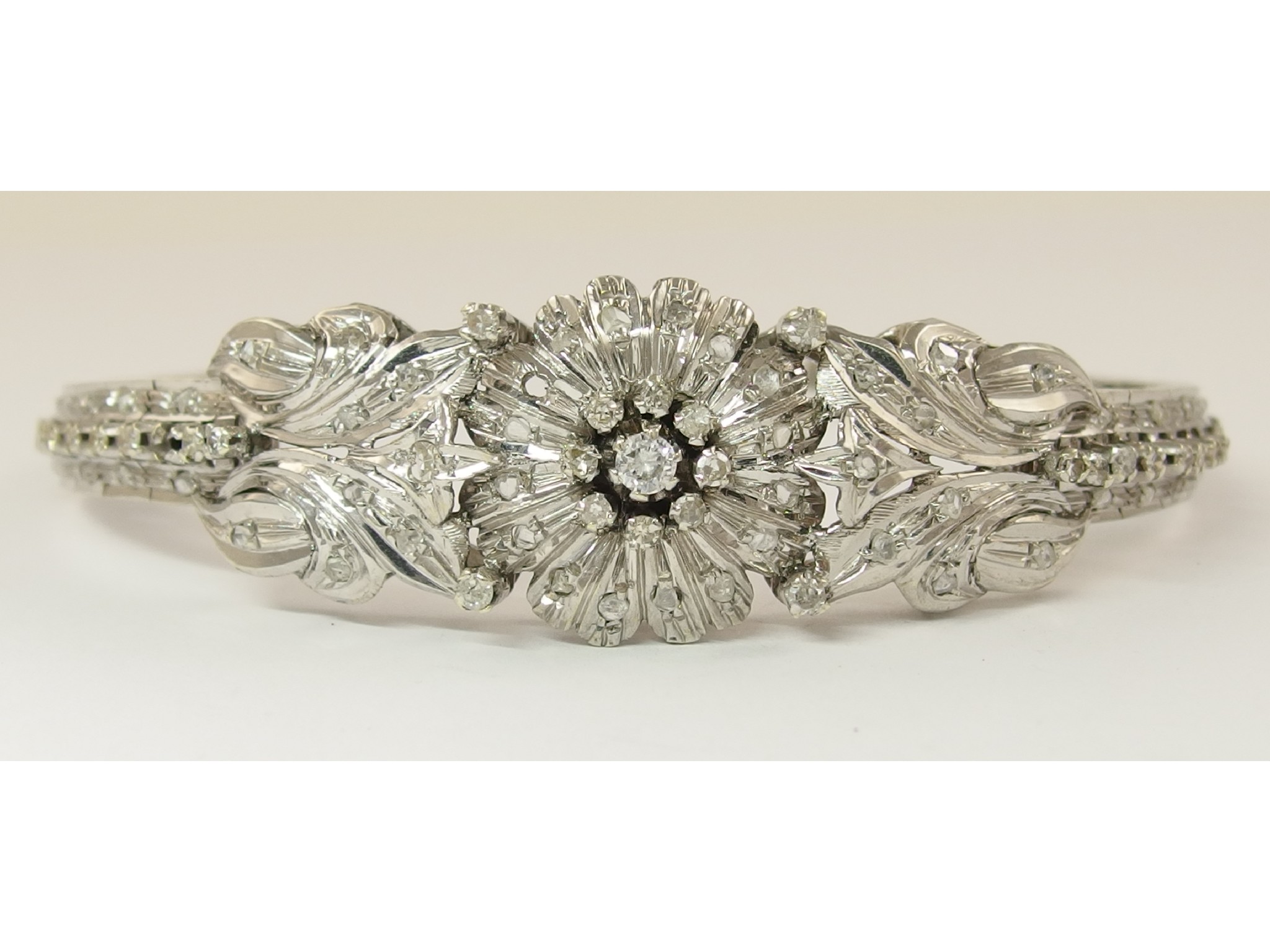 Appraisal: An ct white gold diamond set Lebanese floral braceletdeeply engraved