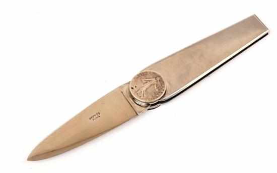 Appraisal: A CLOU DE SELLE LETTER OPENER BY HERMES Styled in