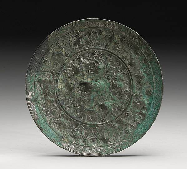 Appraisal: A fine bronze lion and grapevine mirror Tang Dynasty Cast