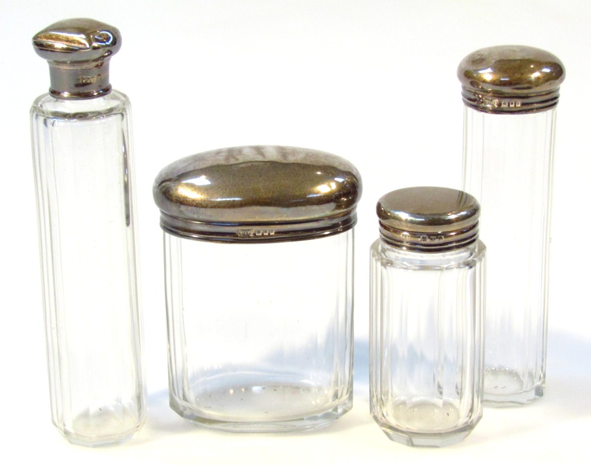 Appraisal: An Edwardian glass and silver dressing table jar the lid