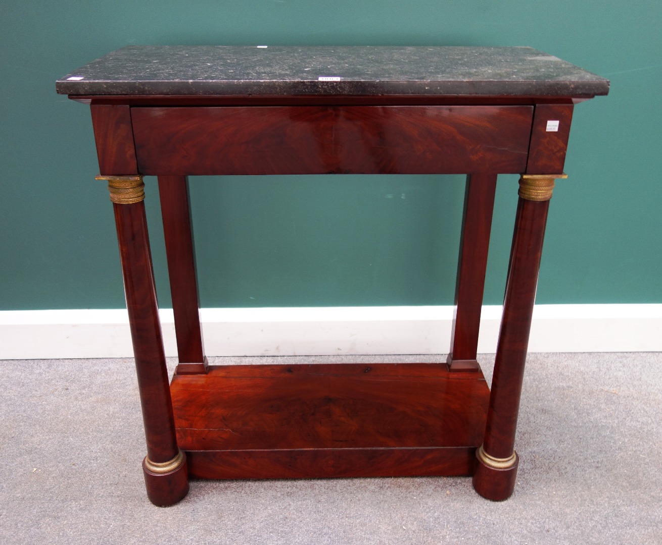 Appraisal: An Empire gilt metal mounted console the black marble top