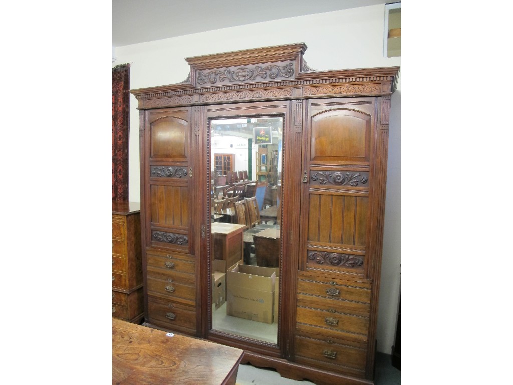 Appraisal: Large Victorian carved mirror door wardrobe