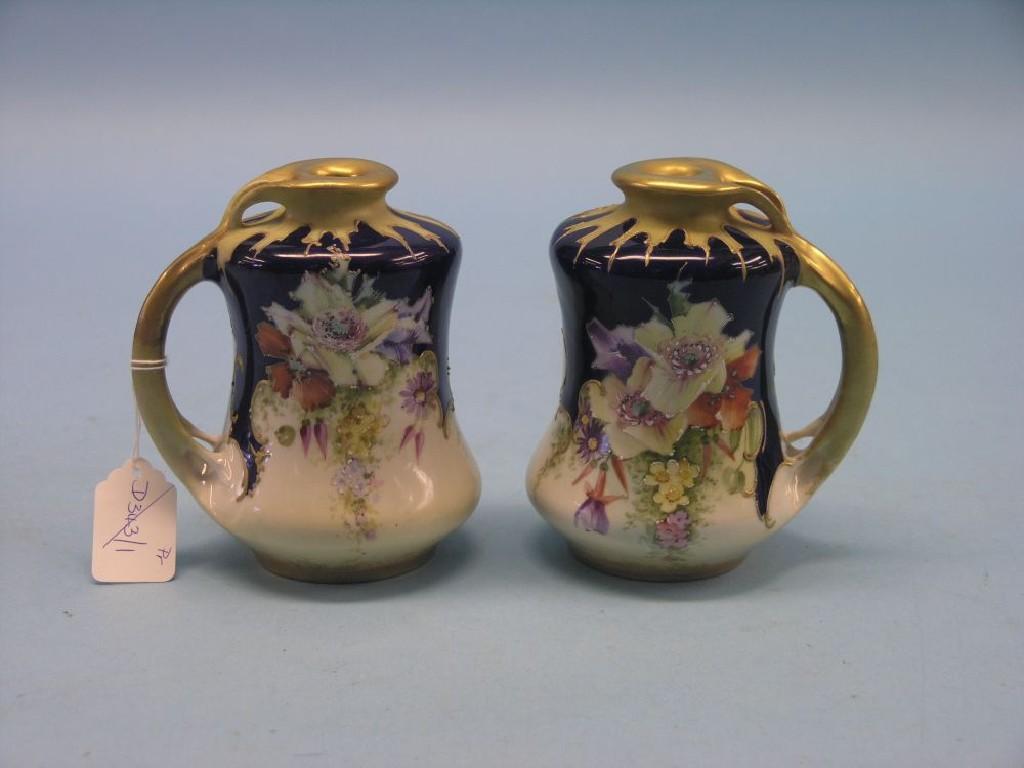 Appraisal: A pair of Amphora porcelain vases Art Nouveau-shape painted with