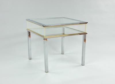 Appraisal: A Glass Acrylic and Chrome Display Table Raised on four