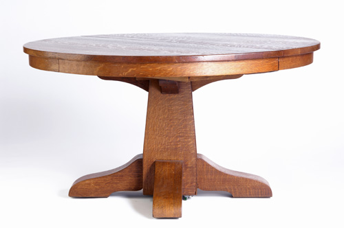 Appraisal: GUSTAV STICKLEY Pedestal dining table with circular top shaped feet