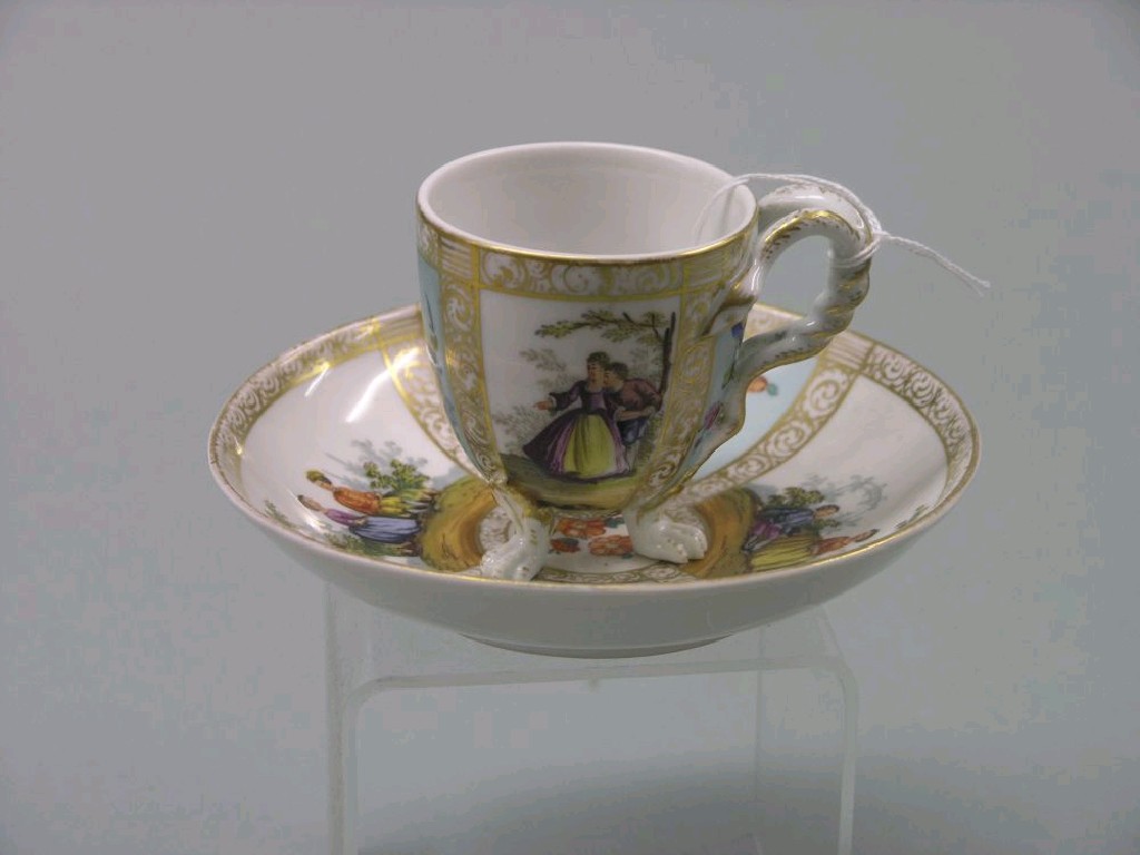 Appraisal: An Helena Wolfsohn cabinet cup and saucer painted with figures