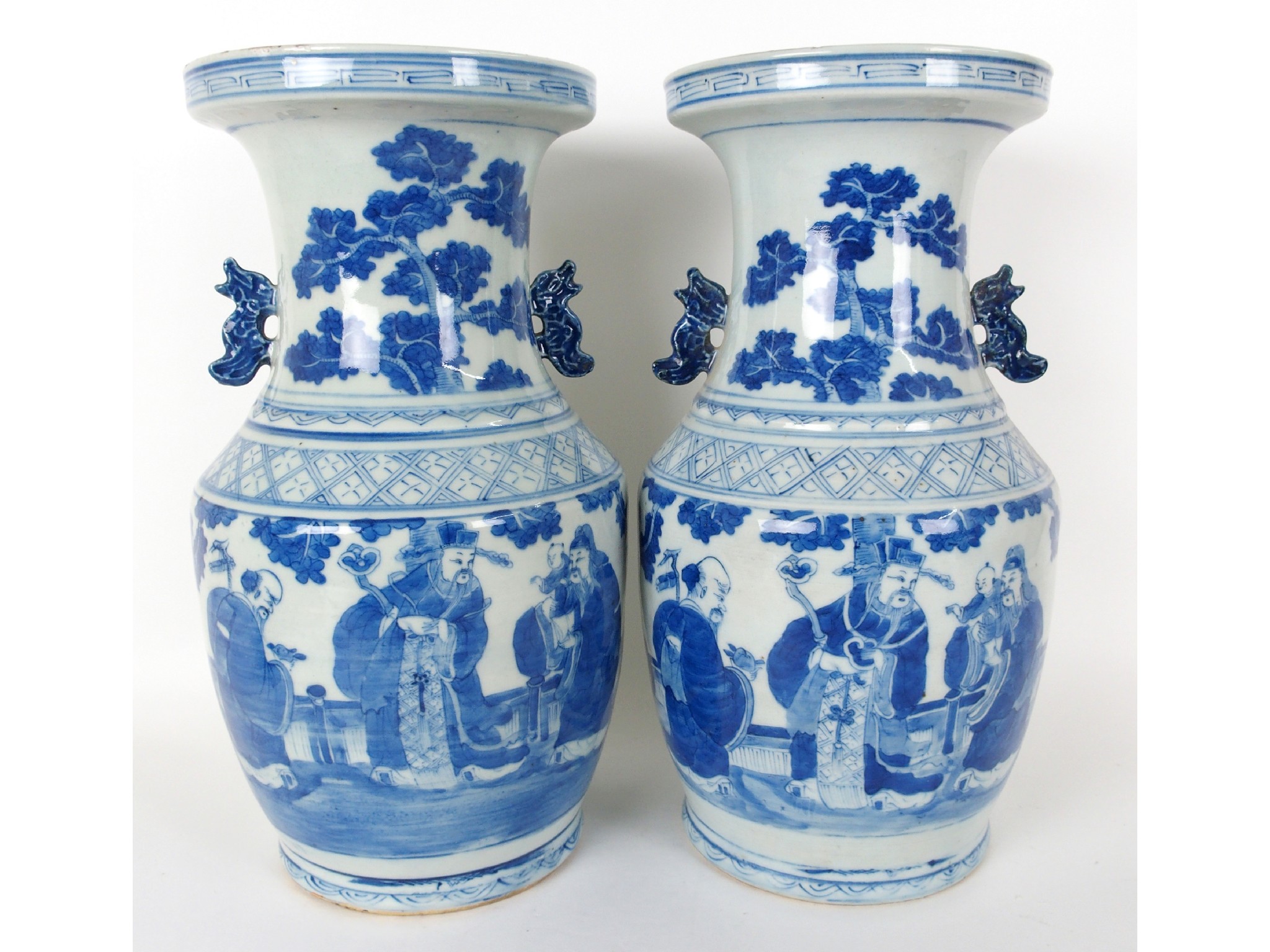 Appraisal: Two Chinese blue and white two-handled vasespainted with mandarins and