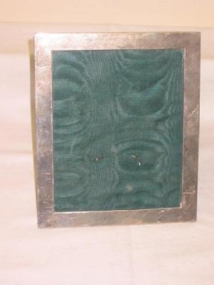 Appraisal: A PHOTOGRAPH FRAME of plain oblong form with green velvet