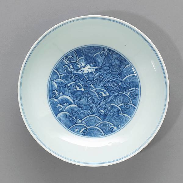 Appraisal: A blue and white porcelain dragon-decorated dish Qianlong Mark and