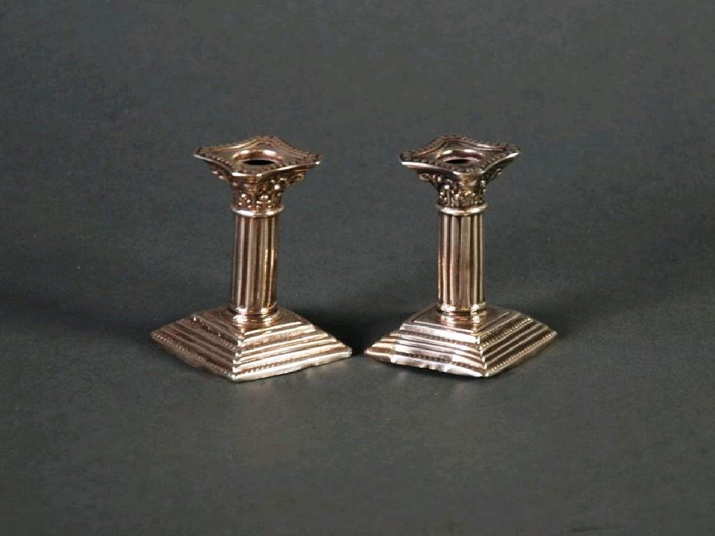 Appraisal: EDWARDIAN VII PAIR OF SILVER MINIATURE CORINTHIAN CANDLESTICKS typical form