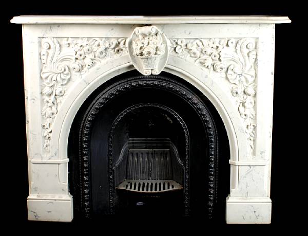 Appraisal: A molded marble fireplace surround with inset cast iron grate