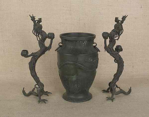 Appraisal: Pair of oriental bronze dragon form candlesticks h together with