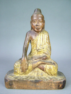 Appraisal: A th th century Burmese carved wooden figure of a