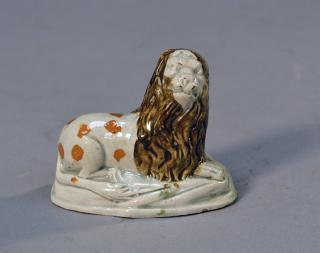 Appraisal: th th C Prattware recumbent lion th th C Prattware