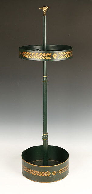 Appraisal: A TOLEWARE STICK STAND with painted decoration and brass knop