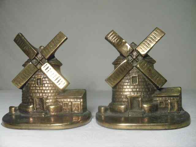 Appraisal: Pair Bronze-flashed iron windmill bookends Circa Condition good age-appropriate condition