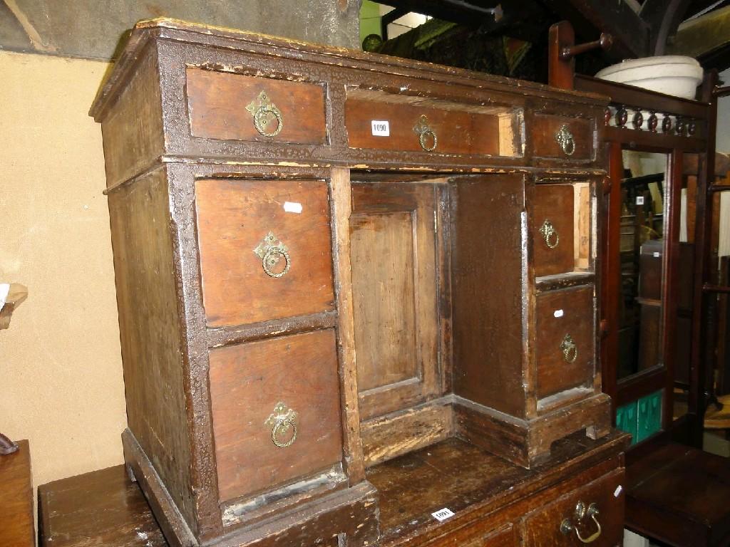 Appraisal: A Victorian stained pine gothic revival kneehole desk fitted with