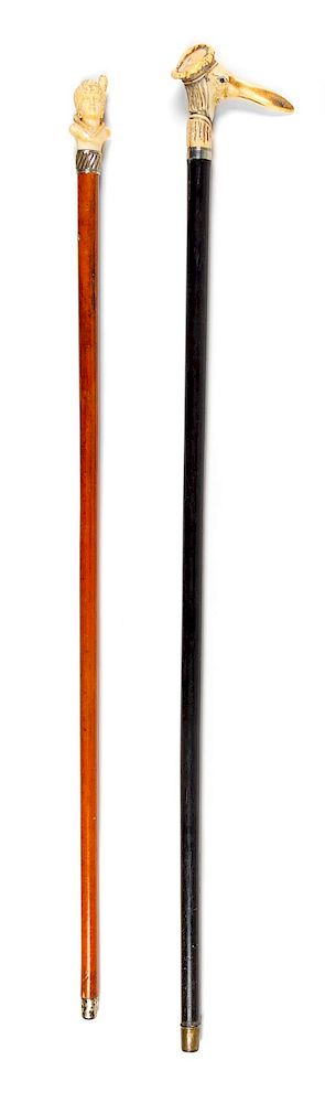 Appraisal: Two Continental Carved Figural Walking Sticks Length of longer inches