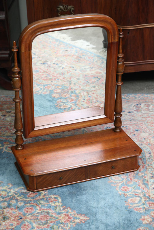 Appraisal: WALNUT SHAVING MIRROR Turned posts bracket an ogee framed tombstone