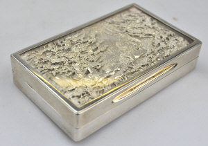 Appraisal: A silver snuff box the hinged lid richly chased with