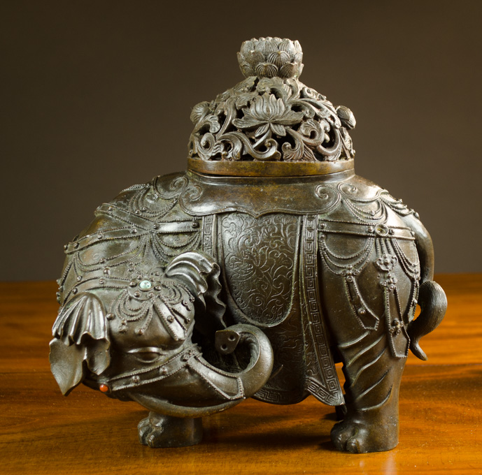 Appraisal: CHINESE QING DYNASTY BRONZE ELEPHANT CENSER a hollow elephant-form vessel