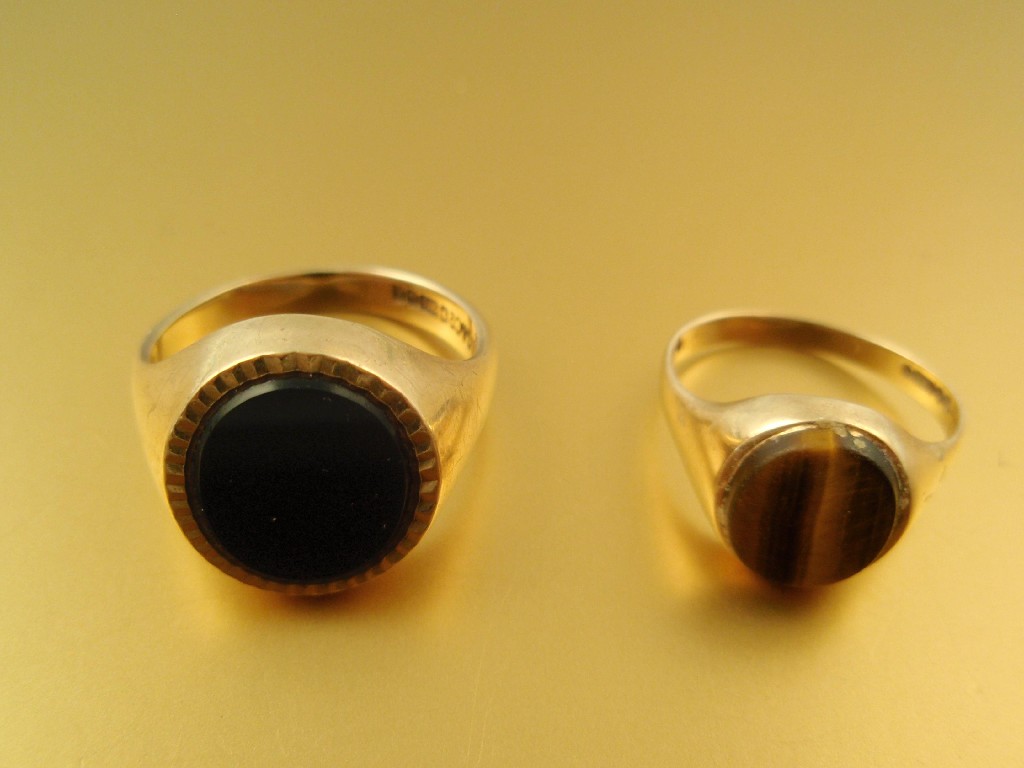 Appraisal: Two stone set gentleman's ct gold signet rings